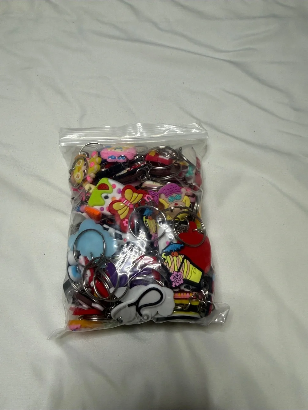 100 Assorted Cartoon Keychain Charms - Pink, Yellow, Red, Blue, White